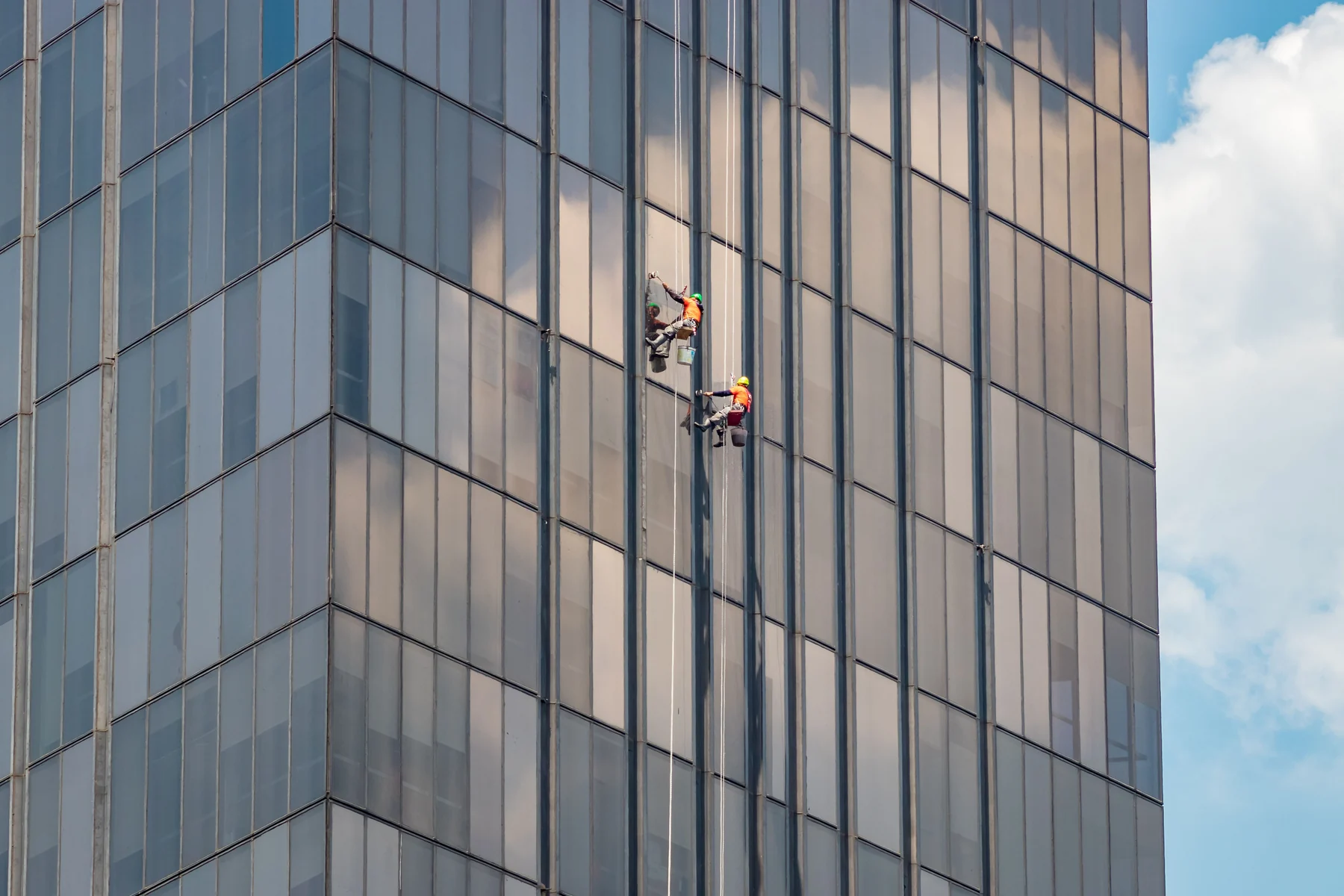 Professional exterior window cleaning on a commercial building